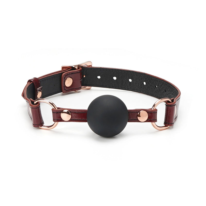 Wine Red leather ball gag with adjustable rose gold metal buckles and black silicone ball from LIEBE SEELE's BDSM collection