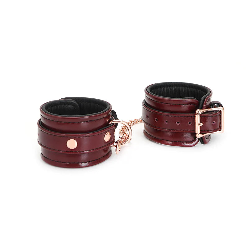 Wine red leather wrist cuffs with rose gold hardware, adjustable straps for BDSM bondage kit