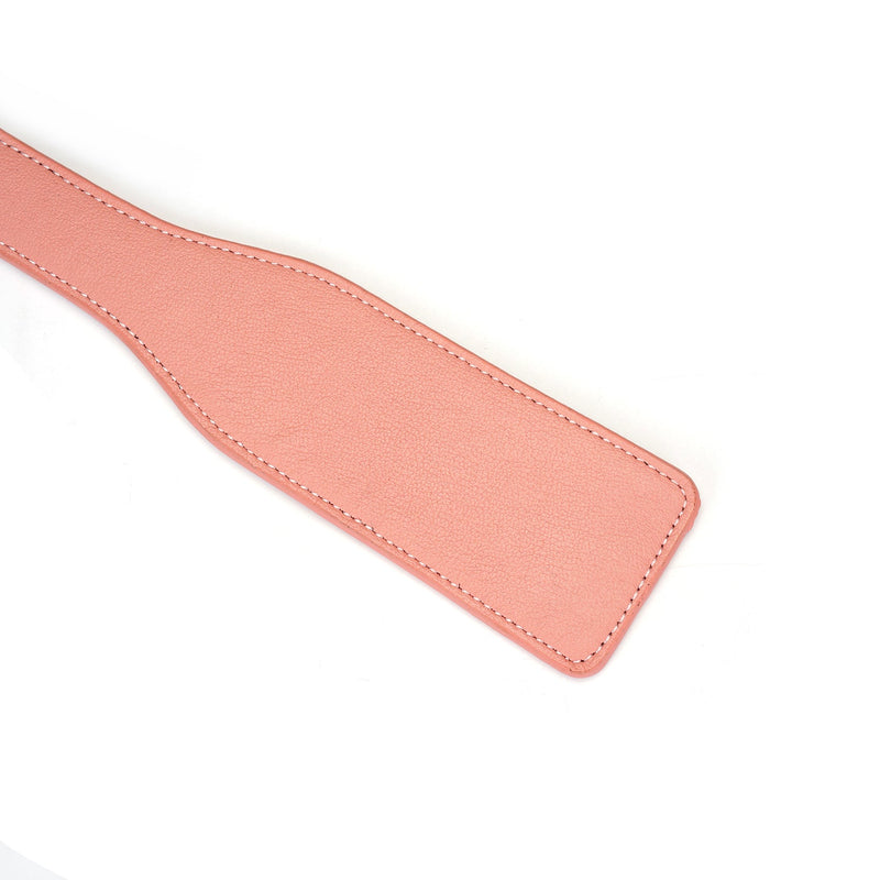 Pink leather bondage spanking paddle from Pink Dream collection for impact play