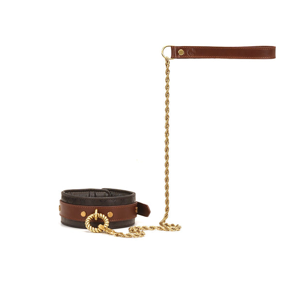 Luxury brown leather bondage collar with gold chain leash and decorative metal element from The Equestrian collection