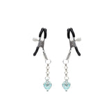 Adjustable nipple clamps with heart-shaped glowing stones for bondage play, set against a white background