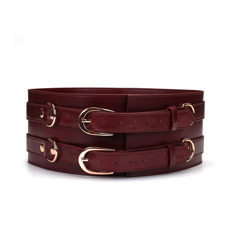 Luxurious wine red leather bondage waist belt with rose gold buckles and D-rings from the Wine Red collection
